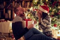 romantic holiday surprise Ã¢â¬â Young man and woman in love at Christmas night. Royalty Free Stock Photo